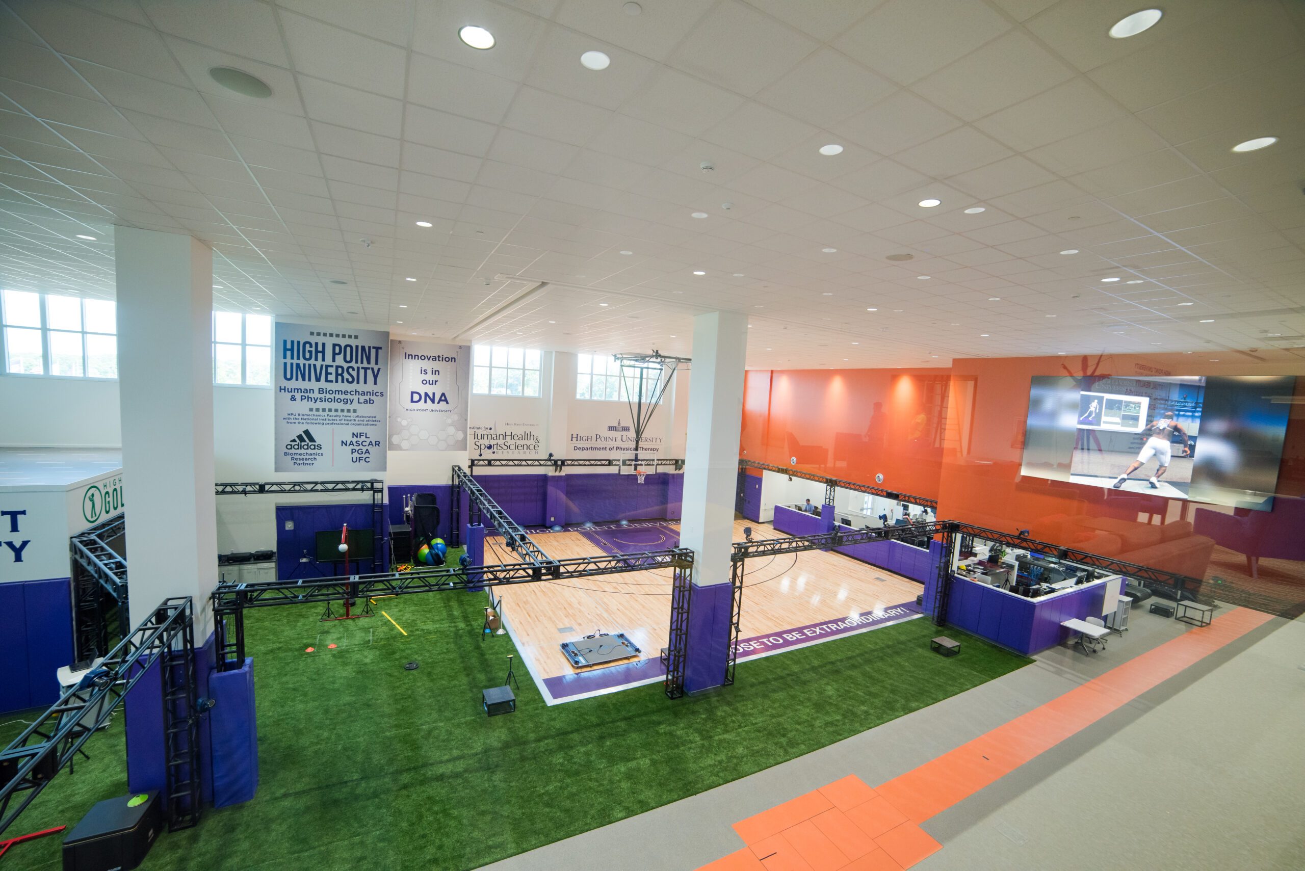 A gym facility with a court and adjoining lab space