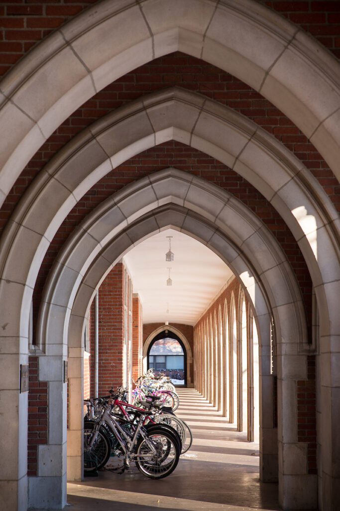 Hallways of arches with bikes