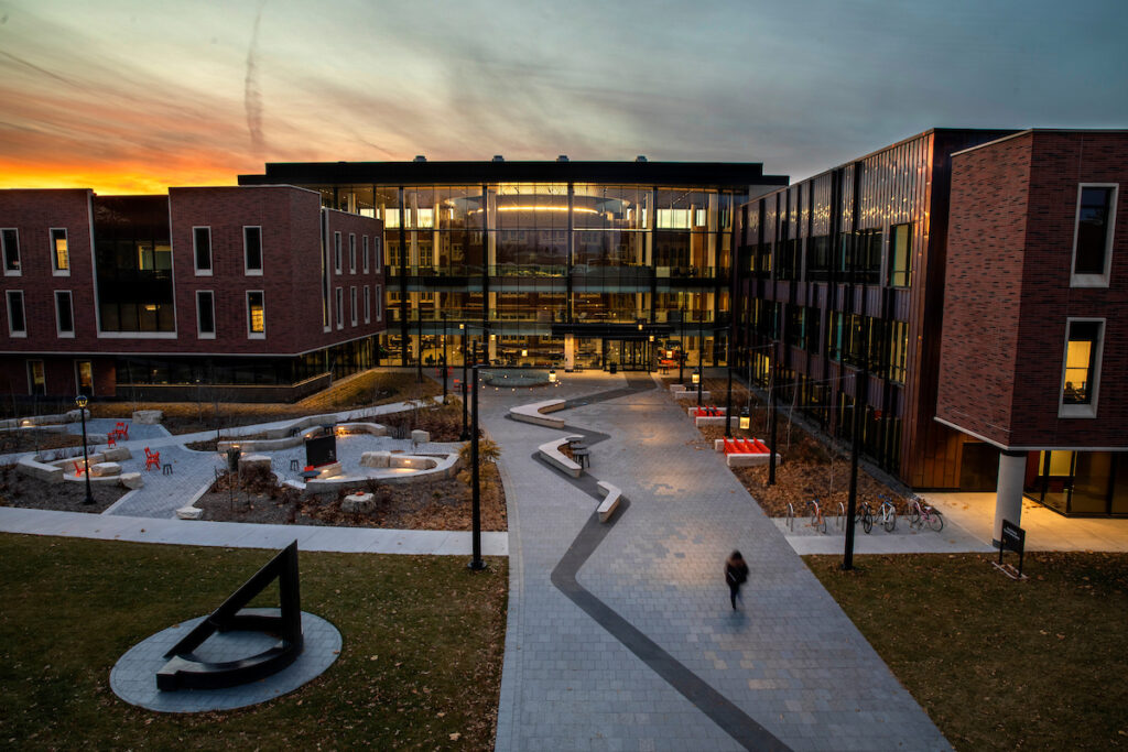 Sunset over student center with large windows
