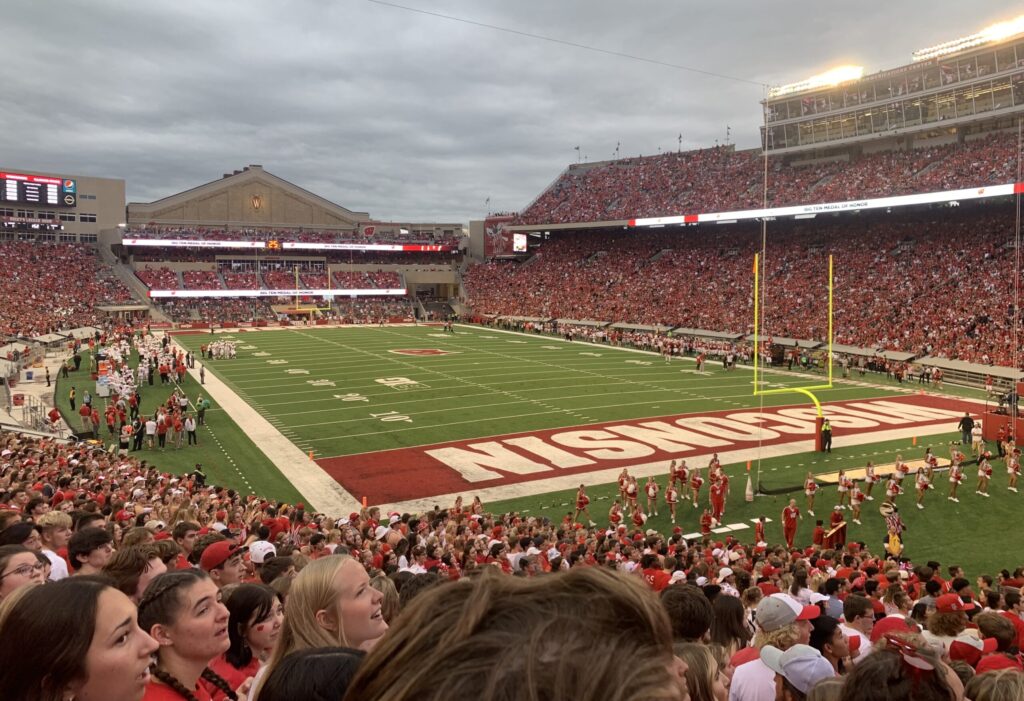 View of University of Wisconsin-Madison football stadium filled with students and fans from high seats in end zone
